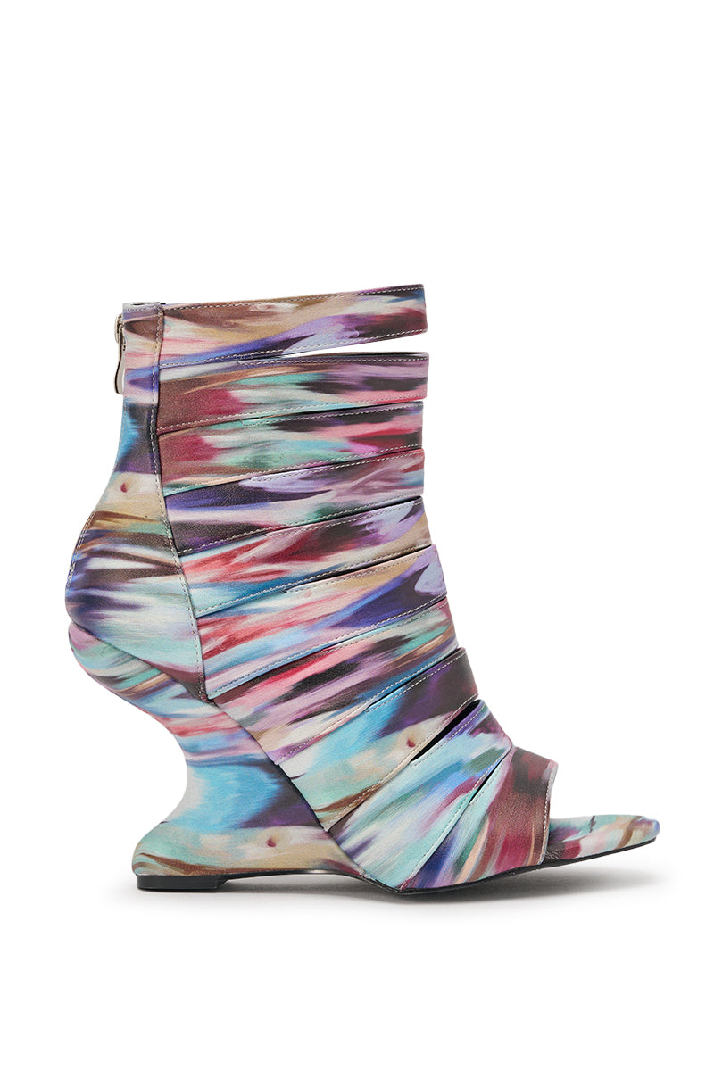 Side view of the AZALEA WANG JOHANNES MULTI RAINBOW WEDGE OPEN TOE BOOTIE—an ankle-high, multicolored bootie with a ruched fabric design, faux leather wedge heel, open toe, and back zipper. 3