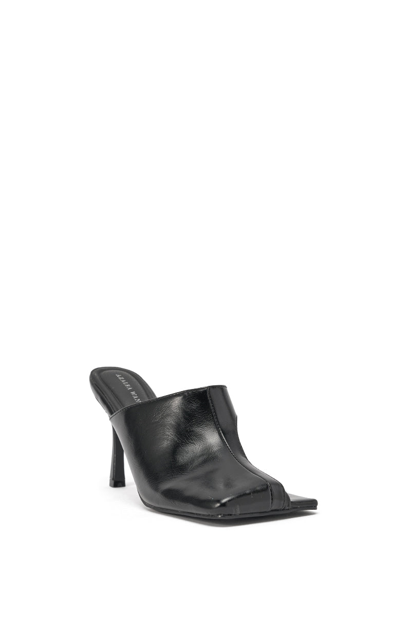 The AZALEA WANG JONENE BLACK STILETTO MULE, a black faux leather mule with a sleek upper, square open toe, and stiletto heel, is displayed at an angle against a white background. 4