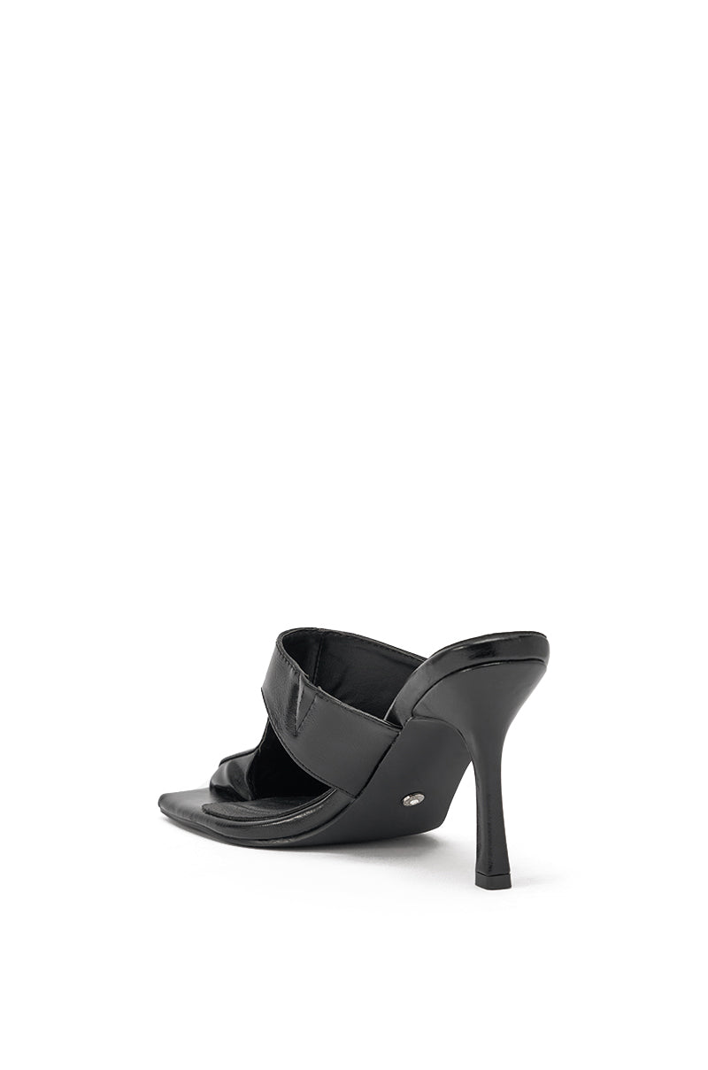 The AZALEA WANG JONENE BLACK STILETTO MULE, featuring black faux leather wide straps and a square toe, is displayed on a white background and photographed to show its back and side profile. 5
