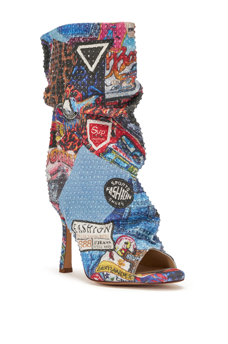 The AZALEA WANG JONICE BLUE MULTI RHINESTONE OPEN TOE BOOTIE is a high-heeled, mid-calf denim bootie with a slouchy fit, open toe, blue-themed design, and colorful rhinestone embellishments. 3