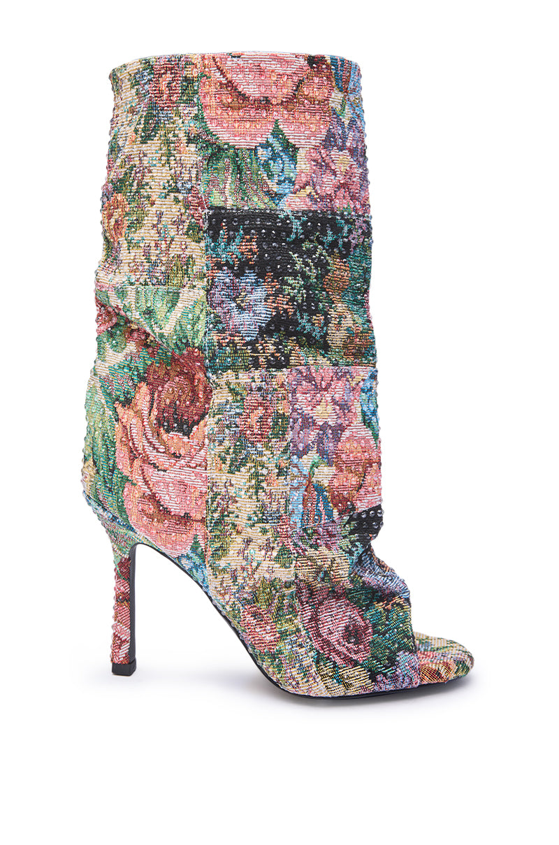 The AZALEA WANG JONICE Floral Rhinestone Embellished Open Toe Bootie features a high heel, colorful floral tapestry pattern, slouchy shaft, and open toe design, shown against a white background.