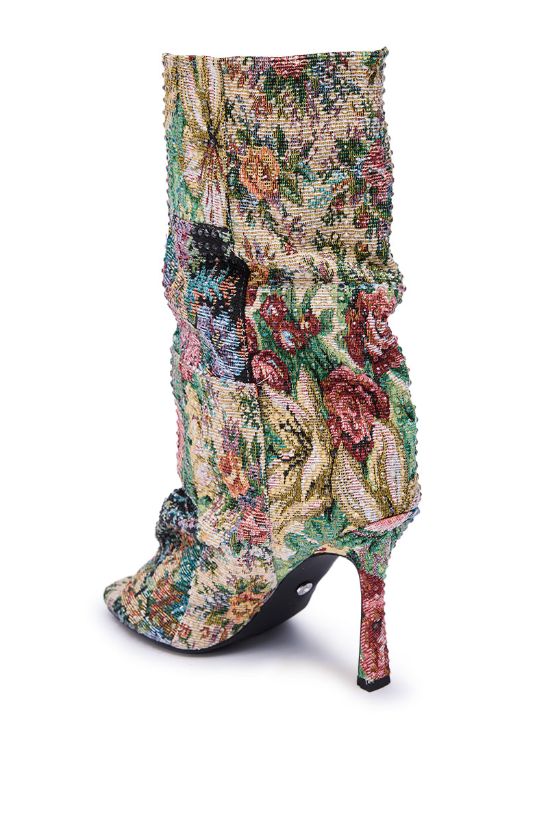 The AZALEA WANG JONICE Floral Rhinestone Embellished Open Toe Bootie features a vibrant floral tapestry, sparkling rhinestones, a pointed toe, slim stiletto heel, and a slouched, textured silhouette for chic flair.