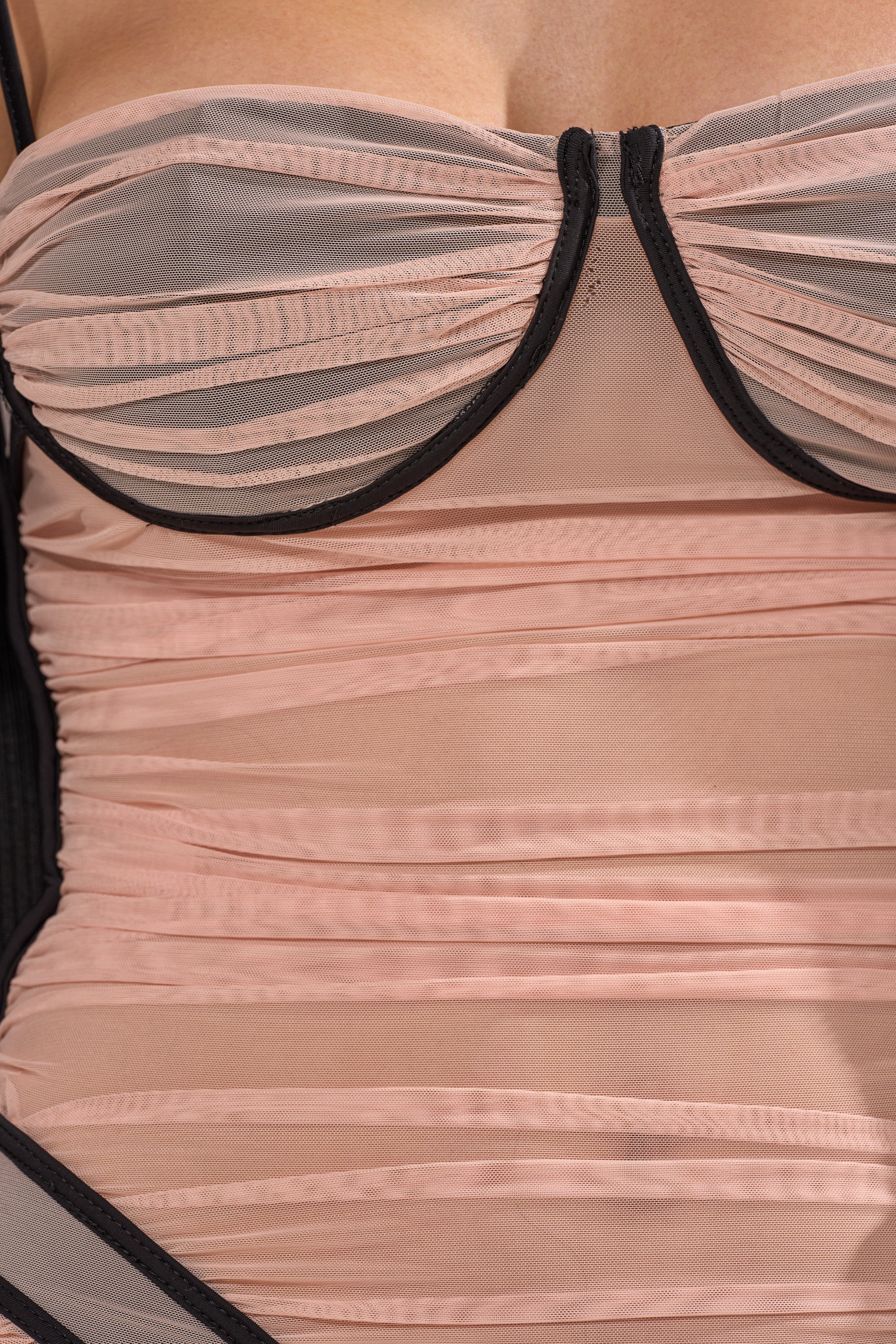 A close-up of the BIKINI BABE MESH MIDI DRESS in pink and black, featuring sheer mesh fabric, ruched overlay, structured cups, and a curve-hugging silhouette. 8