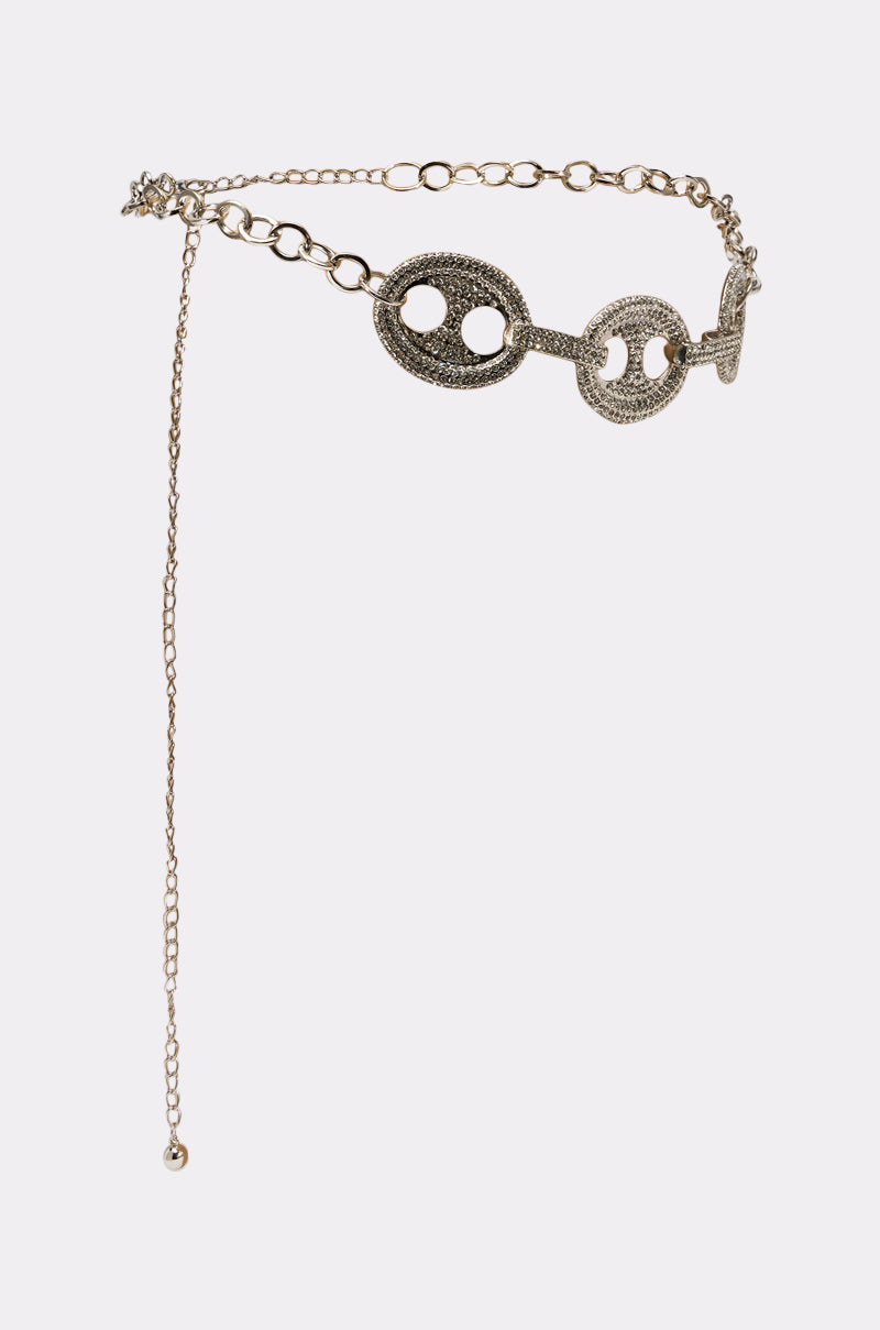The CHAIN BELT features large, textured silver circular links with cut-out designs, smaller connecting links, and a dangling chain with a round bead—ideal for adding a trendy Y2K accent to your style. 3