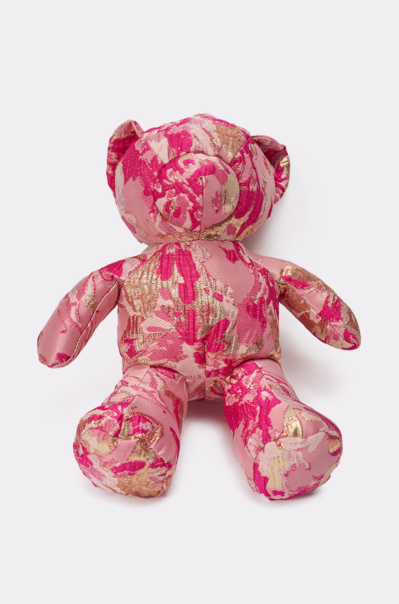 The REALLY ME BROCADE BEAR BAG is a plush teddy bear purse, crafted with shiny pink and gold floral fabric, sitting upright against a plain white background. 3