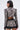 A woman with straight dark hair, seen from behind, wears the PUSH TO START LACE BLAZER as a statement piece with black undergarments, large hoop earrings, and a black belt.
