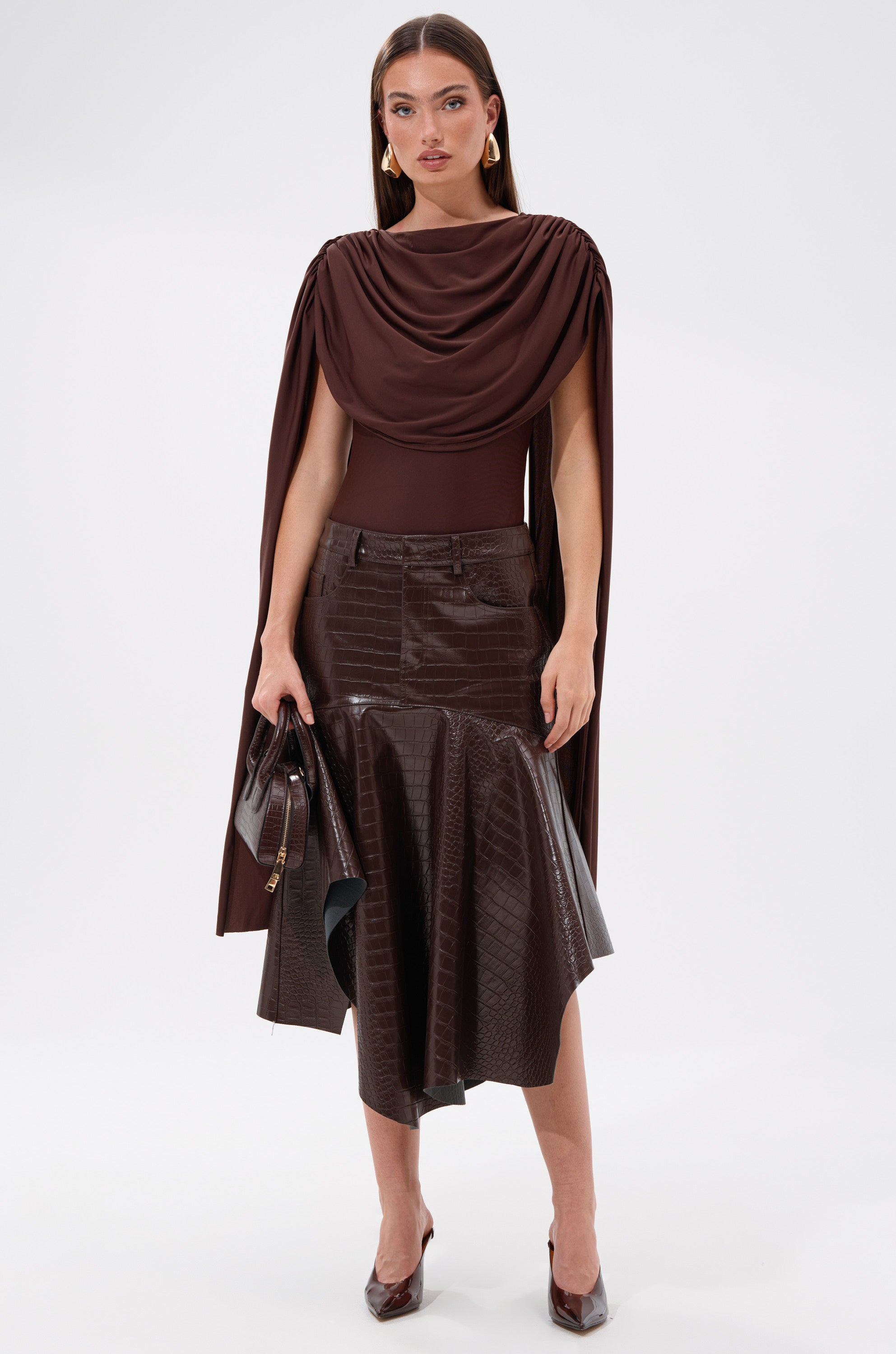 A woman in the RELAX WITH ME CROCODILE MIDI SKIRT in chocolate brown.