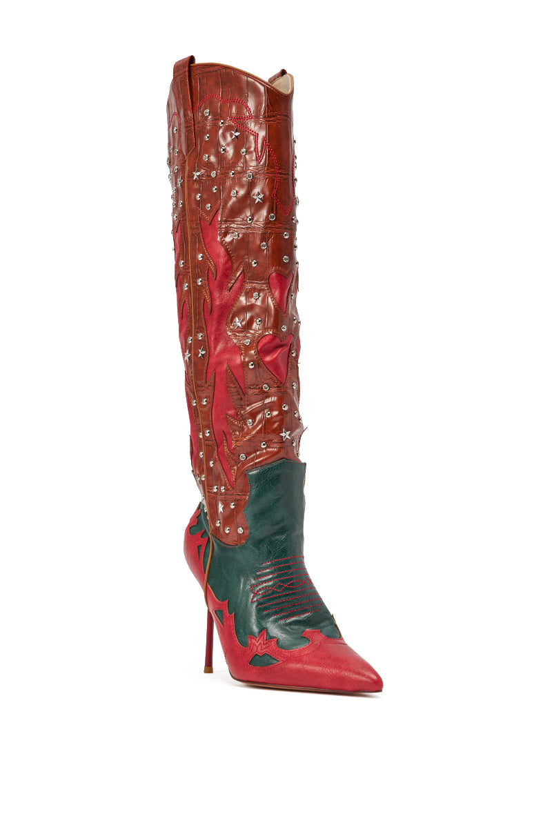 The AZALEA WANG KALPANAS MULTI WESTERN STILETTO BOOT is a tall, pointed-toe knee-high boot with a red stiletto heel, featuring red, green, and brown faux leather, star and flame patterns, and silver stud accents. 4