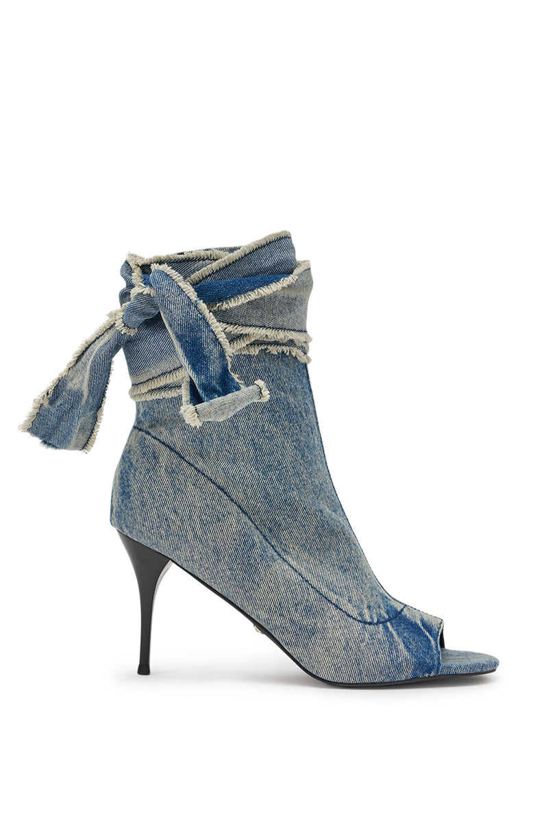 The AZALEA WANG KARTER DENIM OPEN TOE BOOTIE is a high-heeled, distressed denim bootie with frayed edges, a denim ankle tie, and an ankle zip closure, shown against a plain white background. 4