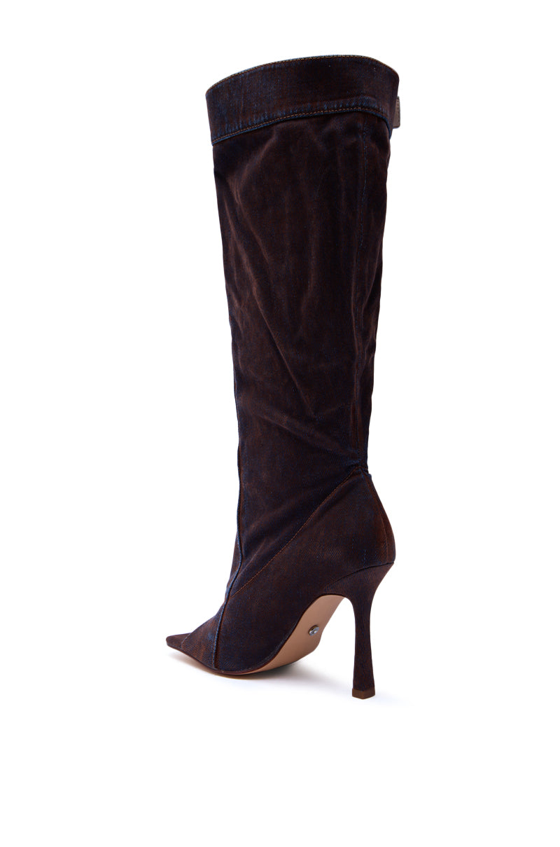 A single knee-high AZALEA WANG KAZUKI Burnt Orange Slouchy Denim Boot with a pointed toe and slim stiletto heel, shown in side view against a white background—perfect for adding standout style to any look. 7