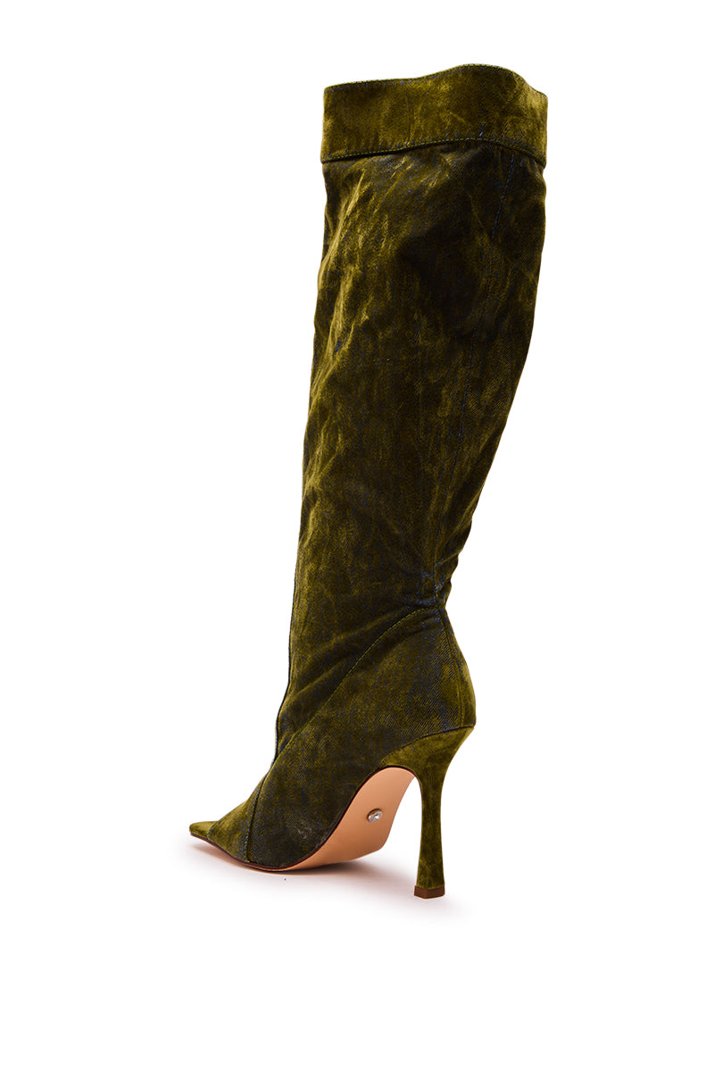 The AZALEA WANG KAZUKI OLIVE SLOUCHY DENIM BOOT is a knee-high boot in olive green denim, featuring a pointed toe and sleek stiletto heel, shown from a rear side angle against a white background.