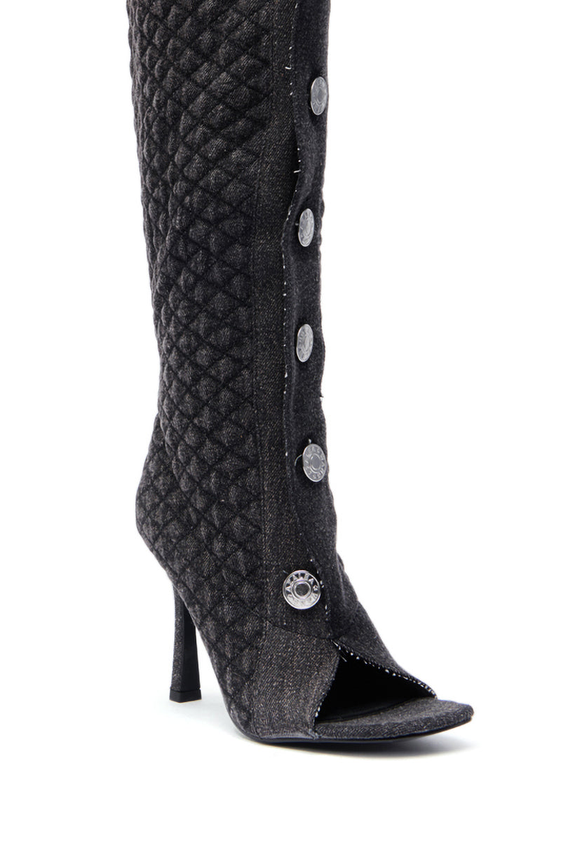 A close-up of the AZALEA WANG KAZUKI GREY QUILTED DENIM BOOT, a knee-high boot featuring silver front buttons, stiletto heel, open toe, and quilted denim design. 6