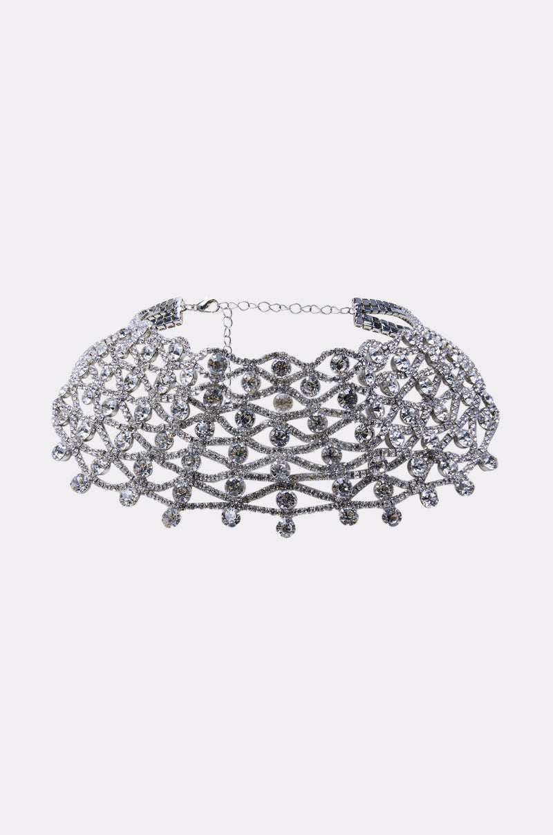 The FOR THE PARTY NECKLACE is a glamorous choker with an intricate net-like lattice design, embellished with sparkling rhinestones and finished with a chain clasp—perfect jewelry for your next event.