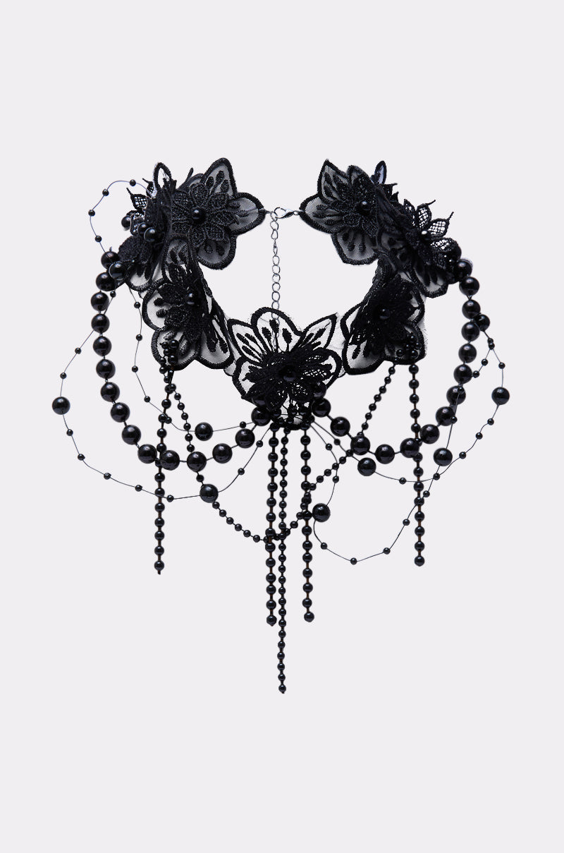 The LIFE OF THE PARTY NECKLACE features ornate black lace with layered floral motifs, hanging beads, and draped beaded chains, creating an elegant, gothic statement choker. 2