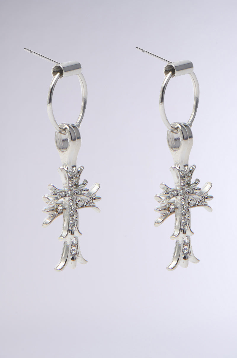 Adorn your favorite moto jacket with CROSS CHARM EARRINGs, featuring a hoop design and rhinestones for a subtle sparkle. 3