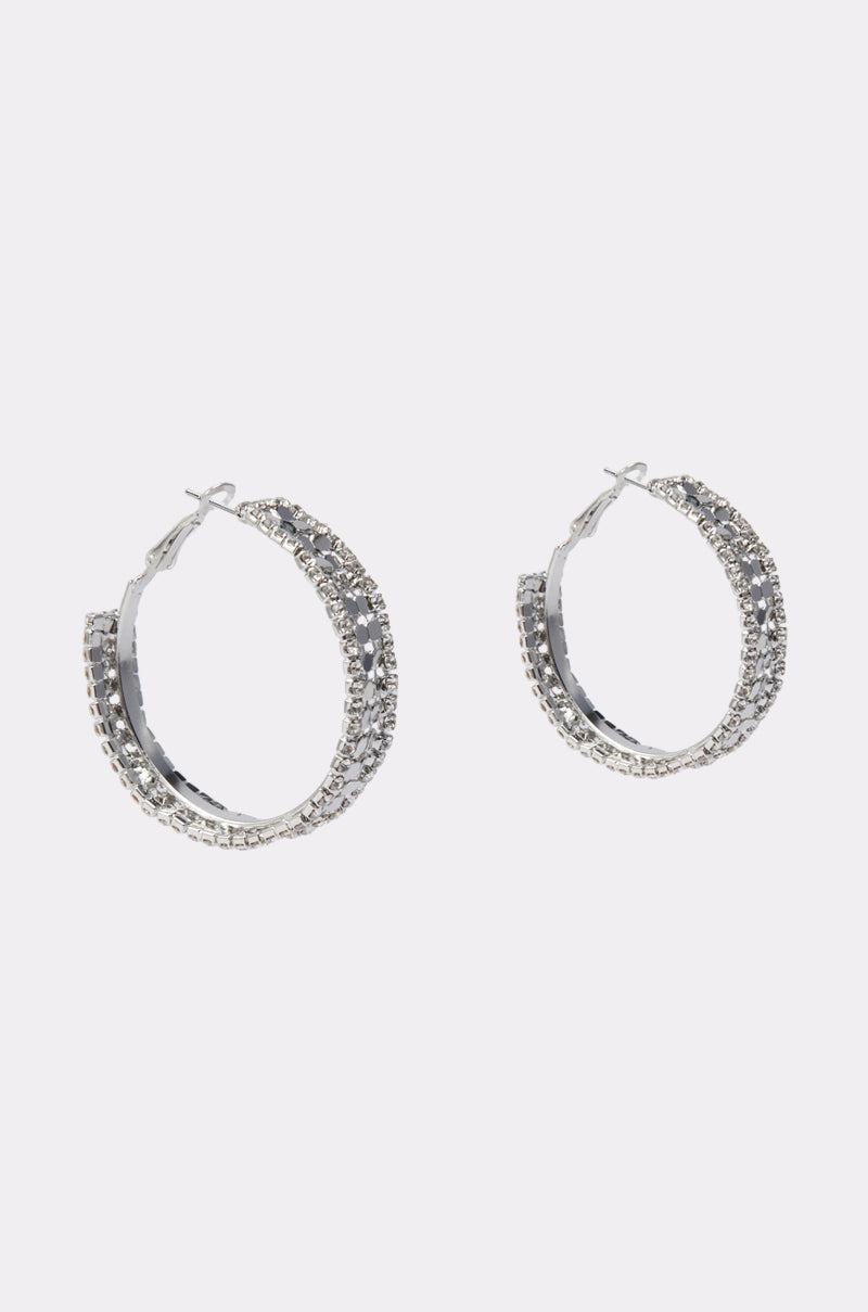 RAZZLE DAZZLE HOOP IN SILVER: Silver hoop earrings featuring two rows of sparkling rhinestone trim, shown on a plain white background.