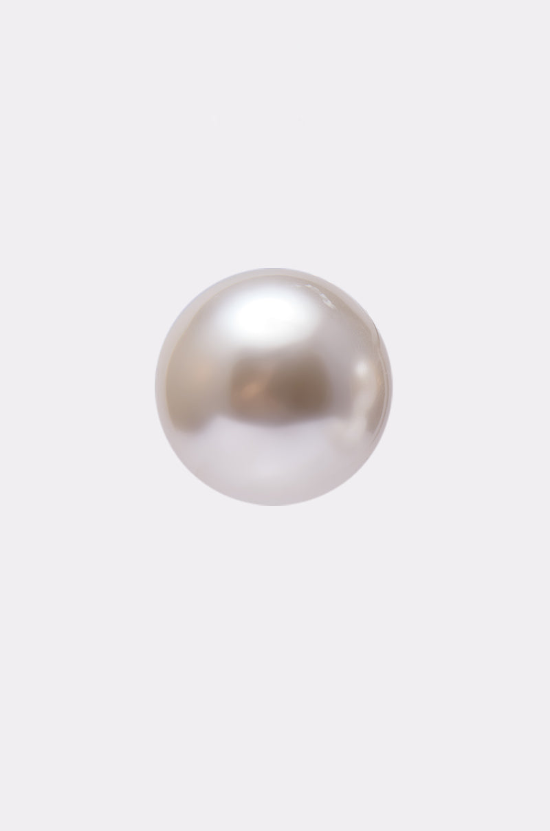 A single round, white pearl with a smooth, shiny surface is centered on a plain light gray background, echoing the elegant style of the TIFF EARRING. 5
