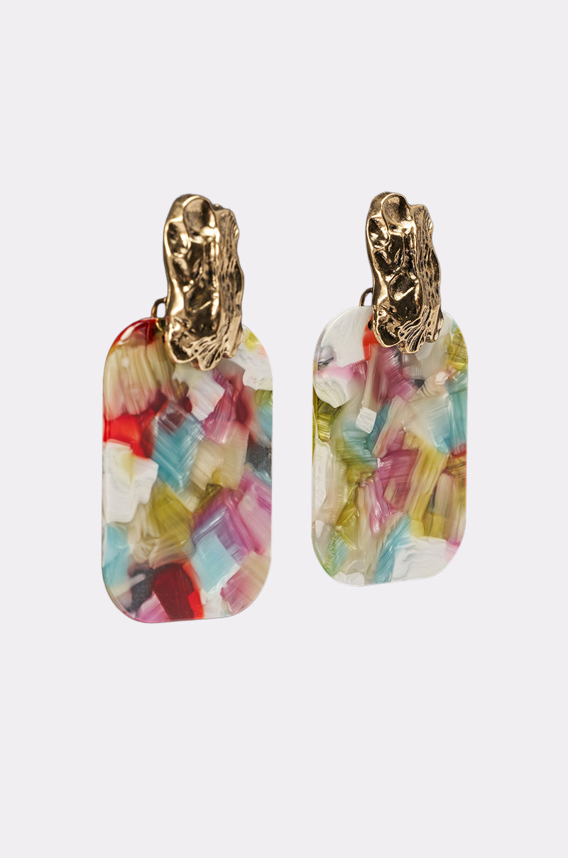 The AT A RESORT EARRING features textured gold tops and rectangular, multicolor marbled resin drops with vibrant brushstroke patterns in red, blue, green, yellow, and white. 2