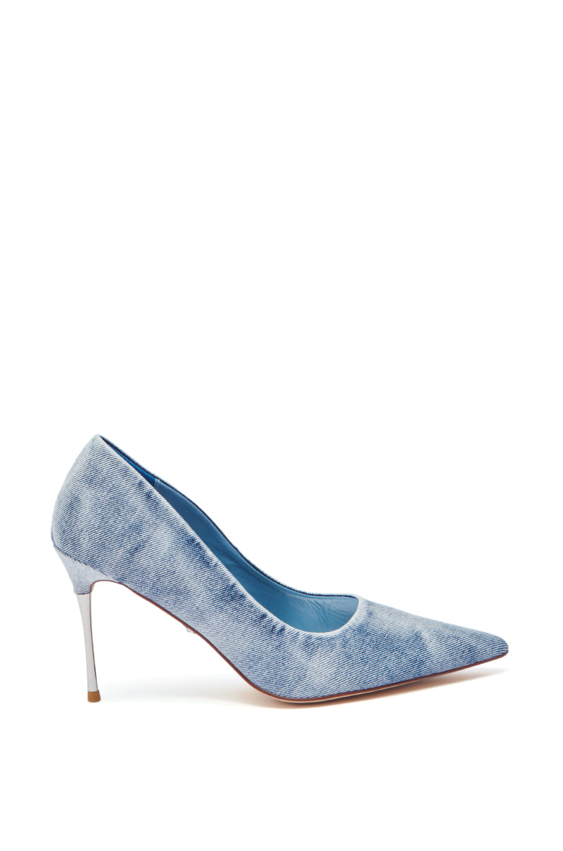 The AZALEA WANG KEATON DENIM STILETTO PUMP is a single pointed-toe stiletto covered in light blue acid wash denim, featuring a thin heel and blue interior.