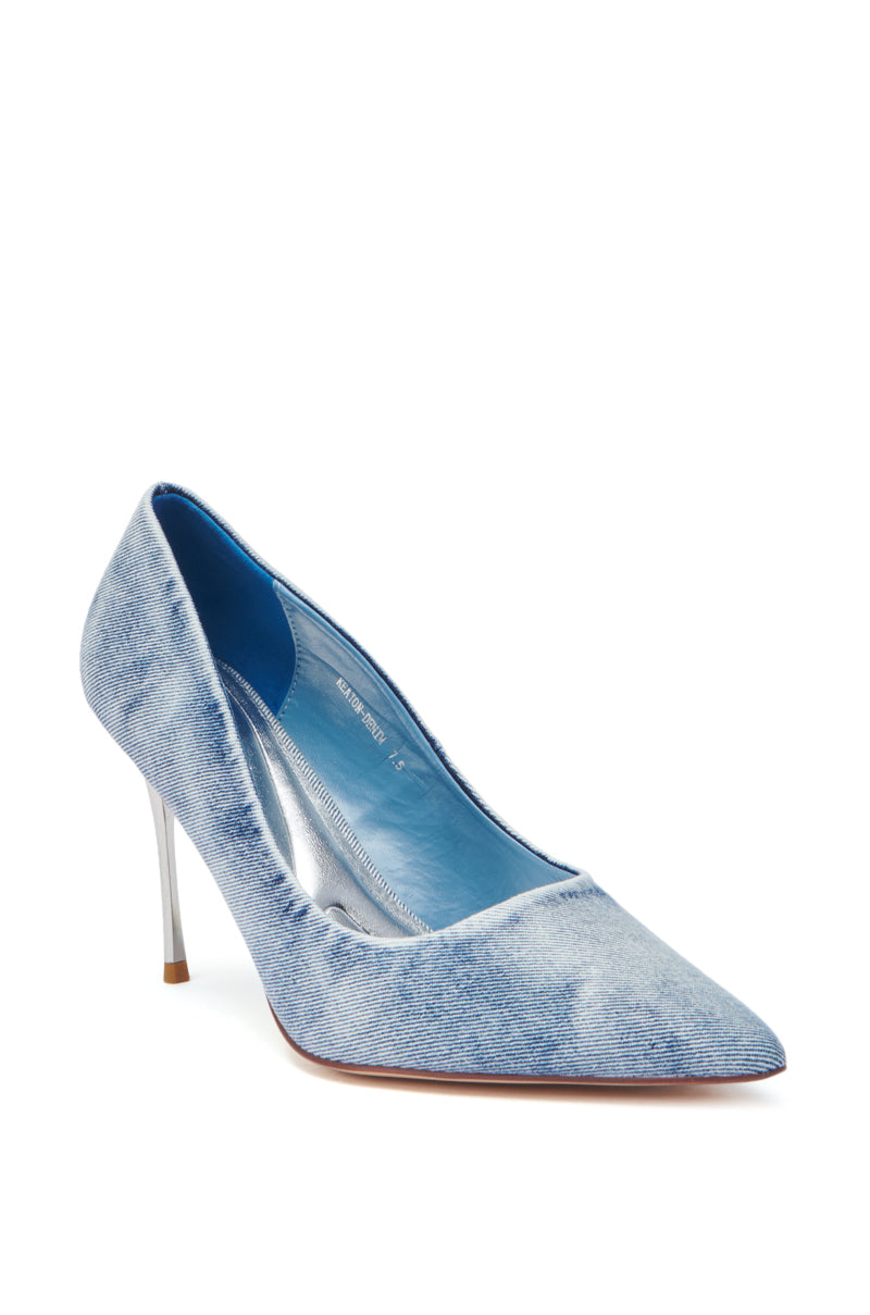 The AZALEA WANG KEATON DENIM STILETTO PUMP features a light blue velvet, acid wash denim look, pointed toe, and slim heel, shown angled on a white background.