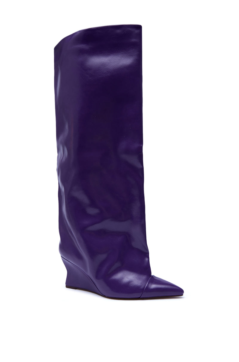 The AZALEA WANG KENYA PURPLE KNEE HIGH WEDGE BOOT features shiny purple faux leather, a pointed toe, and a low wedge heel, displayed against a white background.