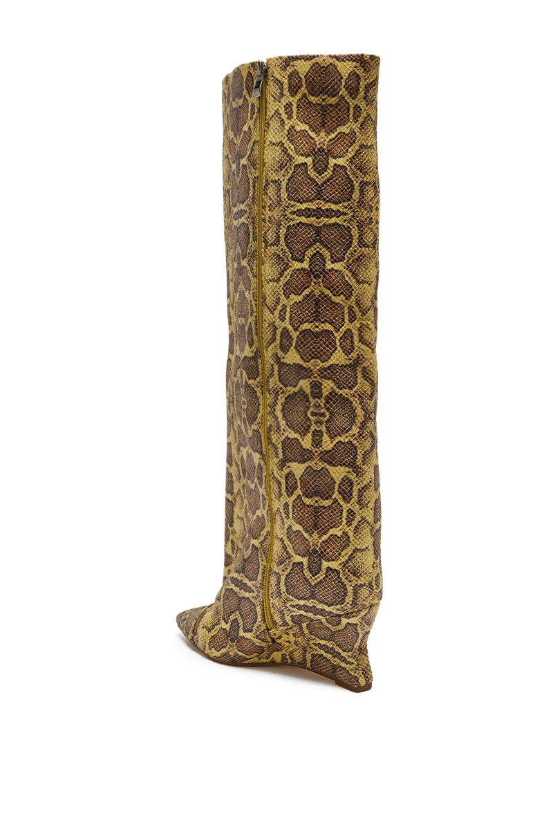 The AZALEA WANG KENYA Yellow Snake Print Knee High Wedge Boot features a tall, pointed toe, yellow and brown snakeskin pattern, knee-high silhouette, side zipper, and is shown from an angled side view.