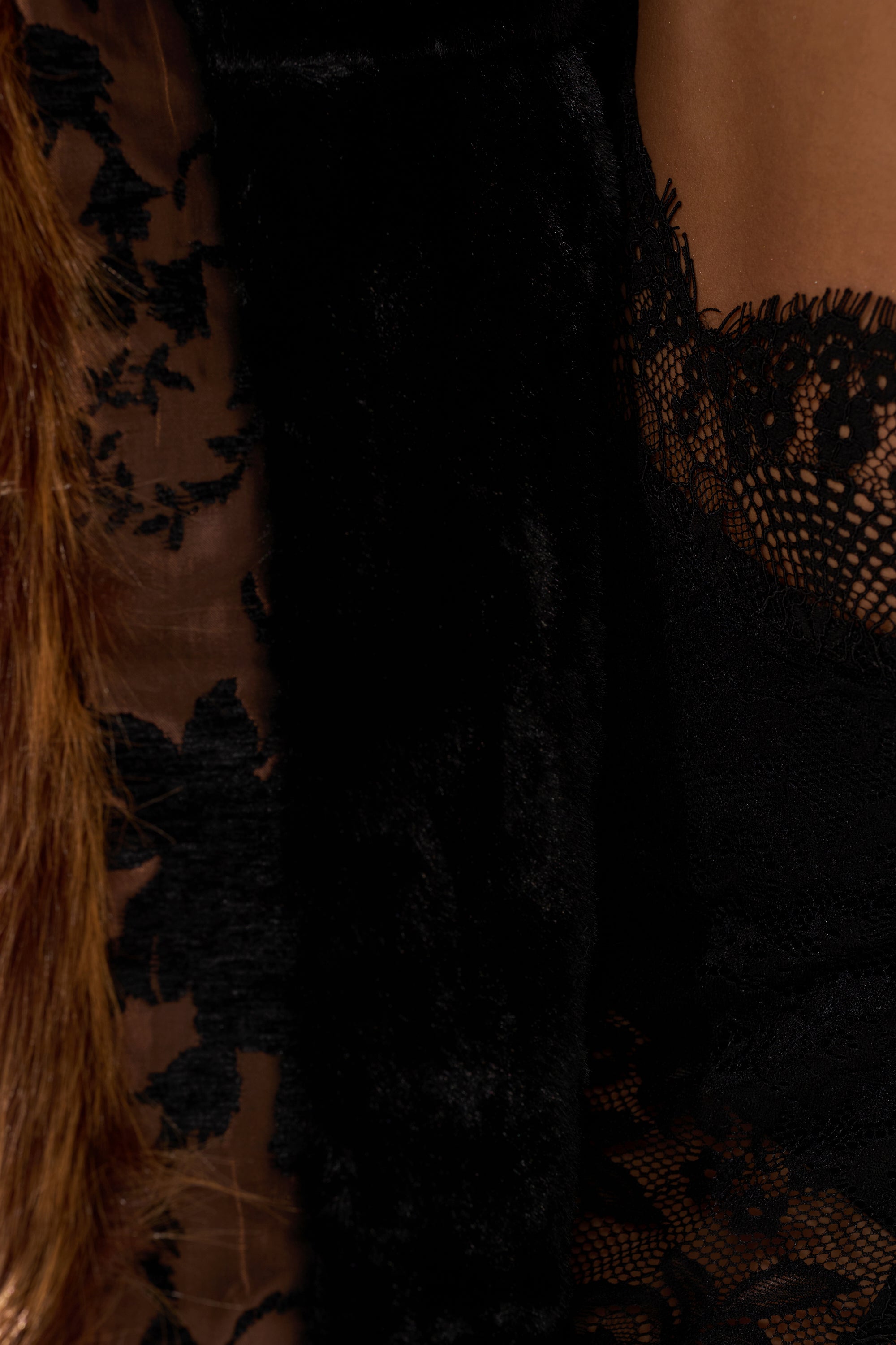 Close-up of the KENZY FUR TRIM MOTO IN JACQUARD featuring sheer black floral lace, soft black fur trim, and a brown faux fur accent resembling a chic collar detail.