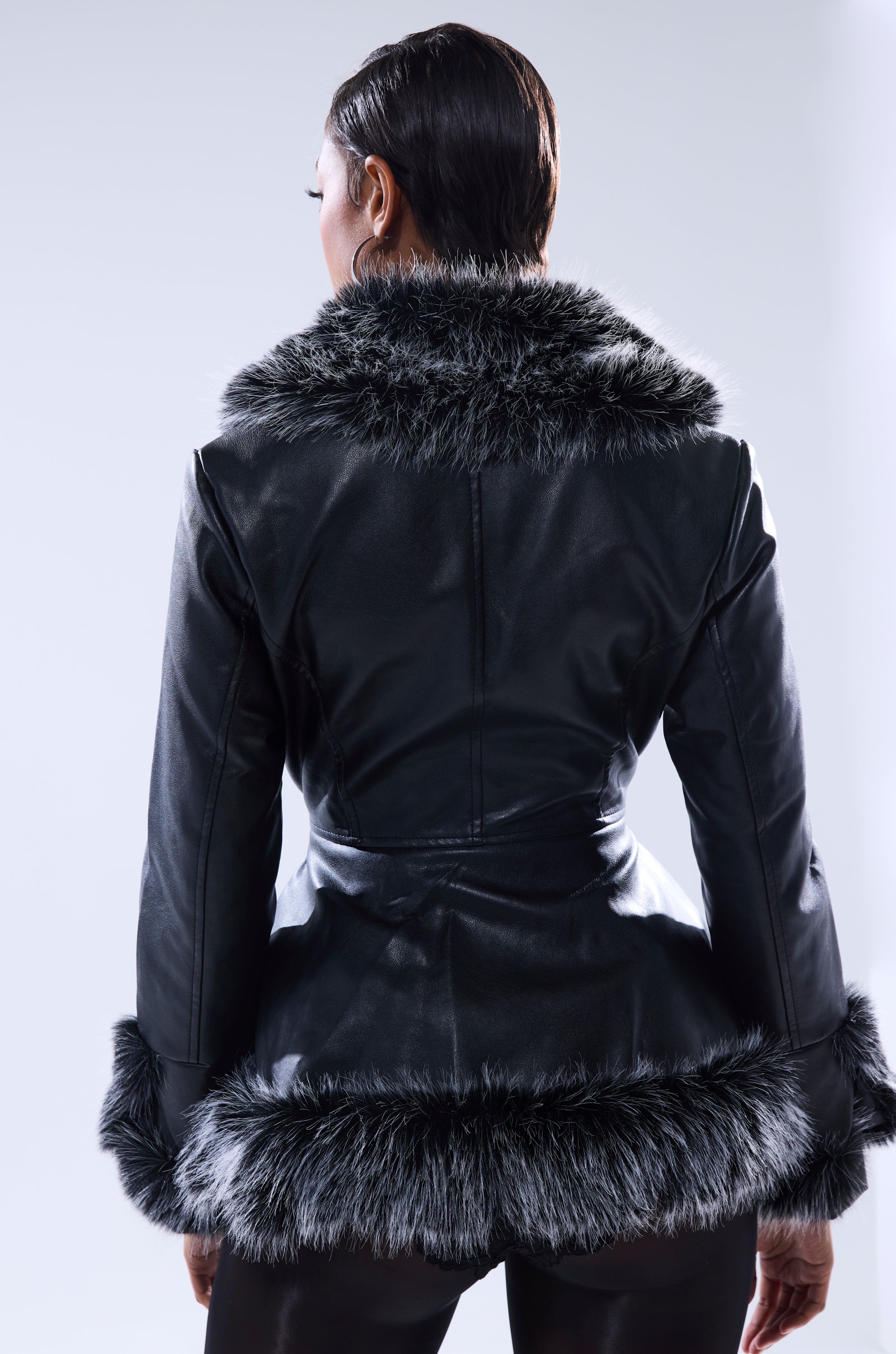 A woman in the NEW KENZY FUR TRIM MOTO jacket.