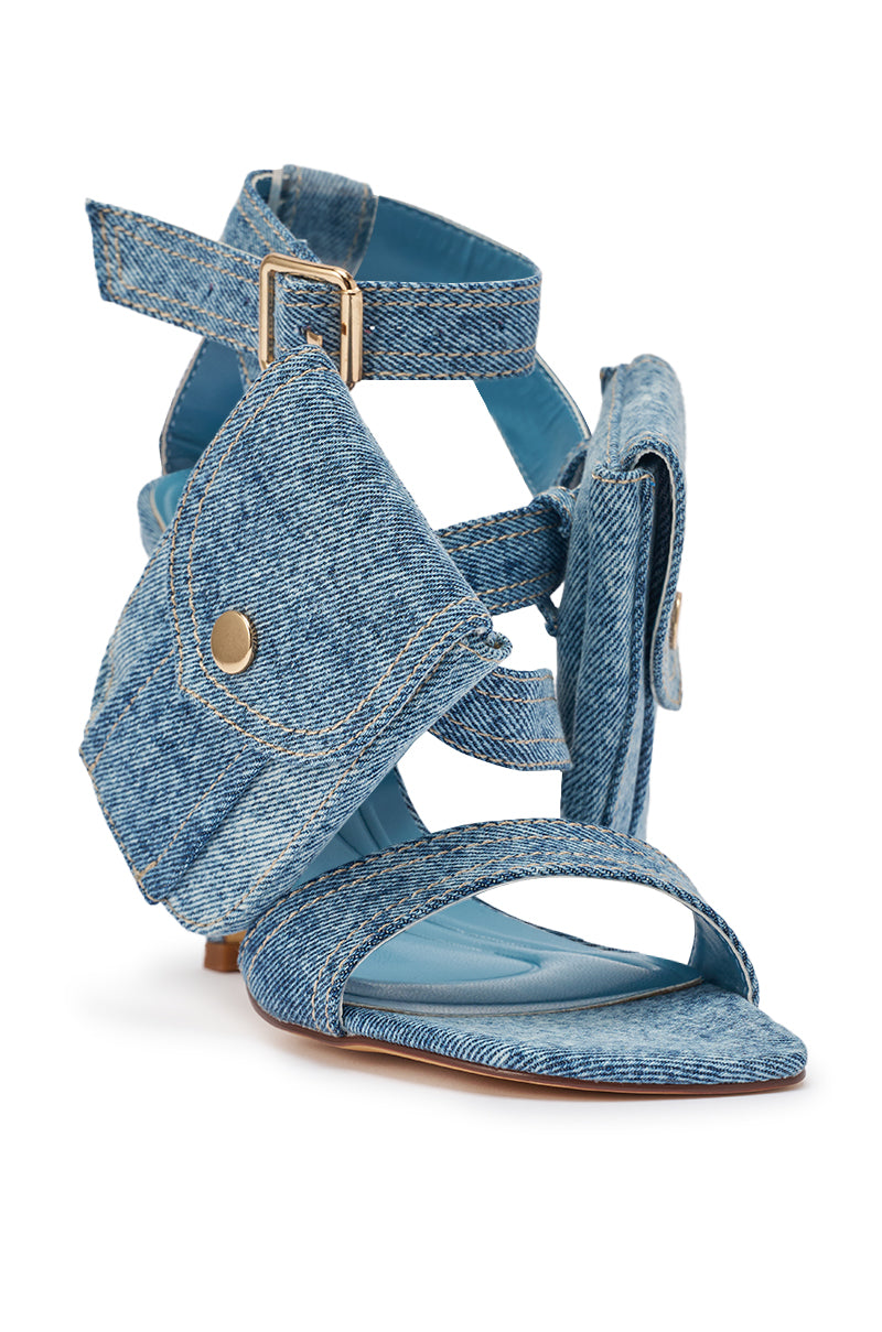 The AKIRA GOLD KERSHAW DENIM POCKET STILETTO STRAP SANDAL features stylish blue denim, multiple straps with gold buckles, mini denim pockets, and a stiletto heel, echoing the look of cargo pocket heels. 7