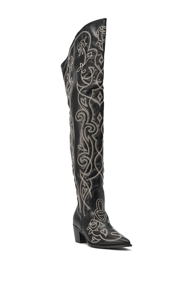 The AZALEA WANG KESS BLACK WESTERN THIGH HIGH CHUNKY BOOT, featuring white embroidery, a pointed toe, and a low angled heel, stands upright on a white background. 6