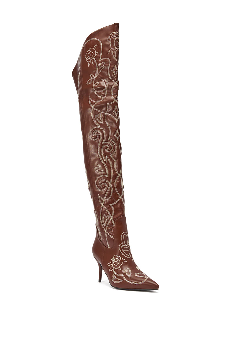 The AZALEA WANG KETA BROWN WESTERN THIGH HIGH STILETTO BOOT features brown faux leather, intricate white floral and swirl embroidery, and a stiletto heel. 4