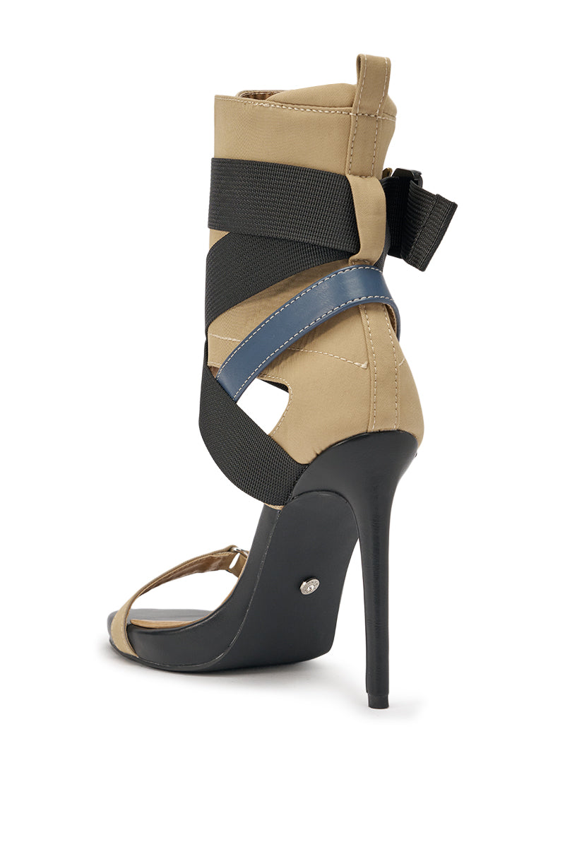 The AZALEA WANG KIVA KHAKI STILETTO SPORTY SANDAL features a beige upper, black stiletto heel, crisscross black and blue elastic straps, a bold black back bow, open toe, modern style, and comfort cushion insole for all-day wear. 5