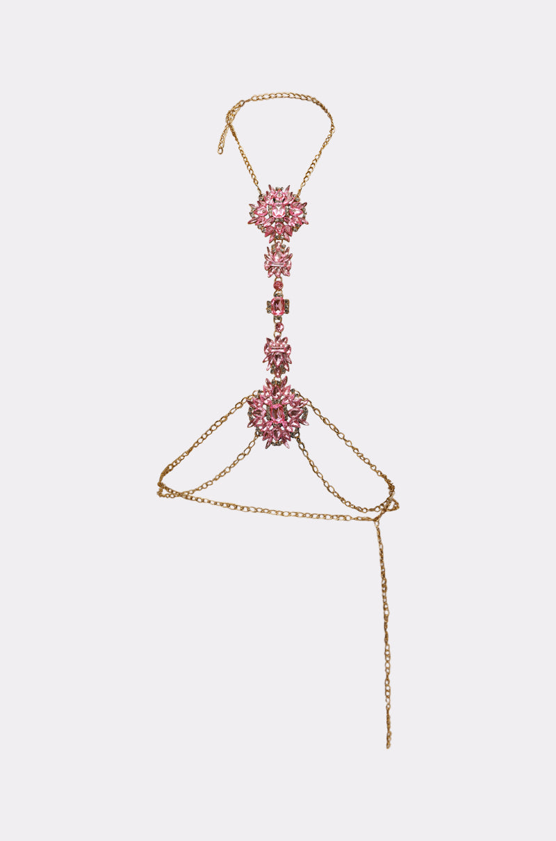 The PRETTY IN PINK BODY CHAIN features three vertical clusters of pink gemstones and delicate gold chains that wrap around the waist—a stunning choice for festival jewelry or as a chic layered waist chain. 1