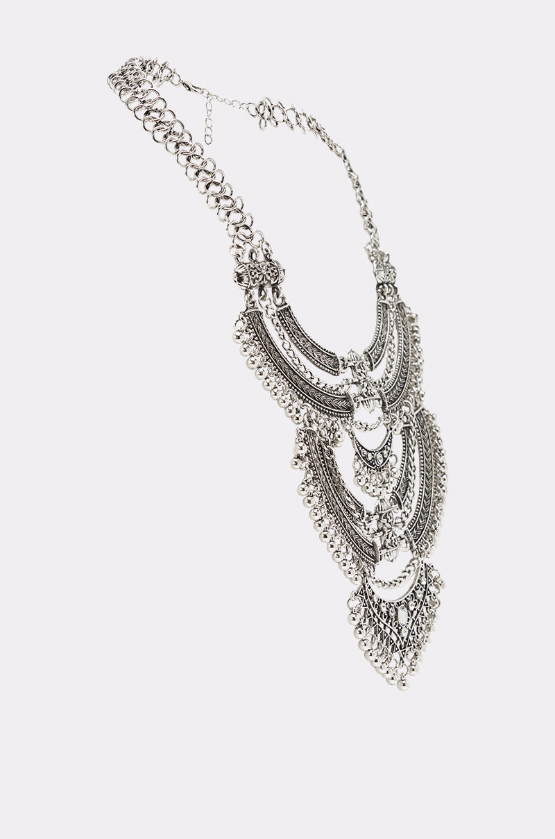 AT THE FESTIVAL NECKLACE: Ornate silver-tone boho statement necklace with intricate layered metalwork and dangling beads, shown on a white background. 4