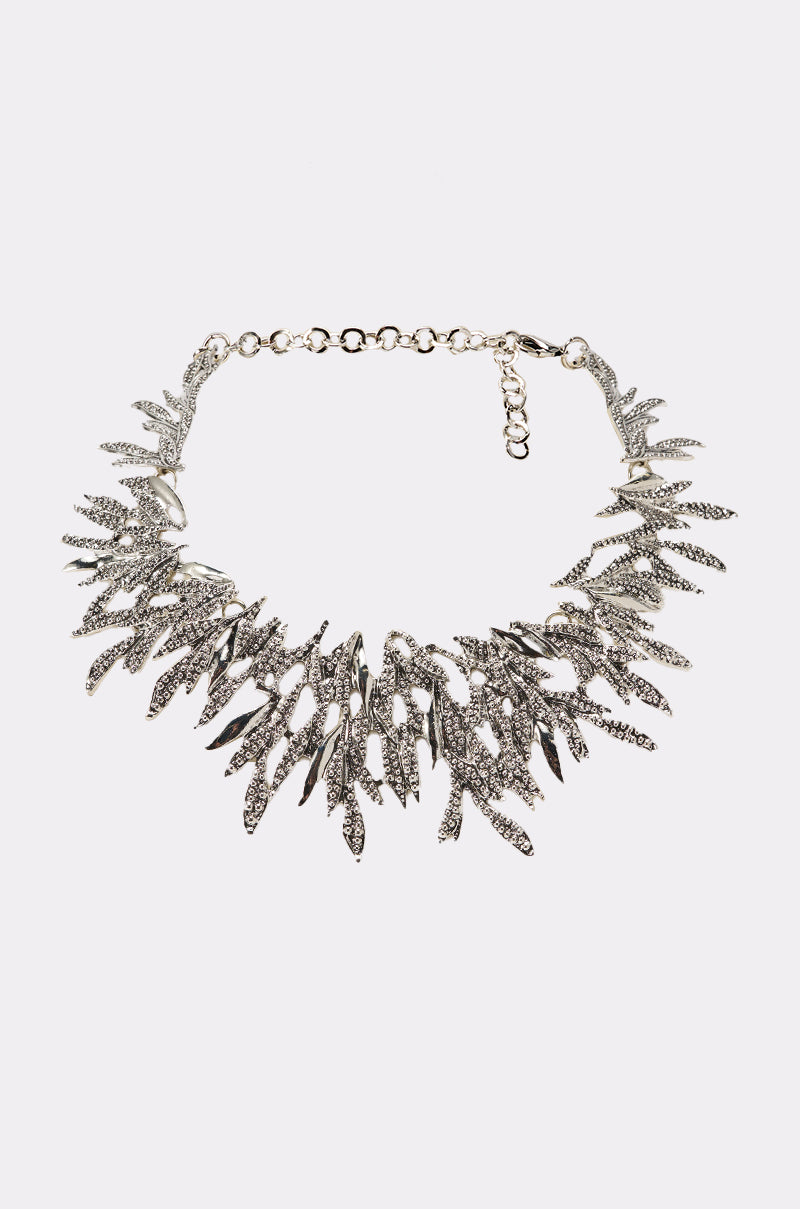 The COME THRU NECKLACE is a leaf-inspired collar necklace with silver-textured metal charms in a symmetrical, spiky design and an adjustable chain clasp. 0