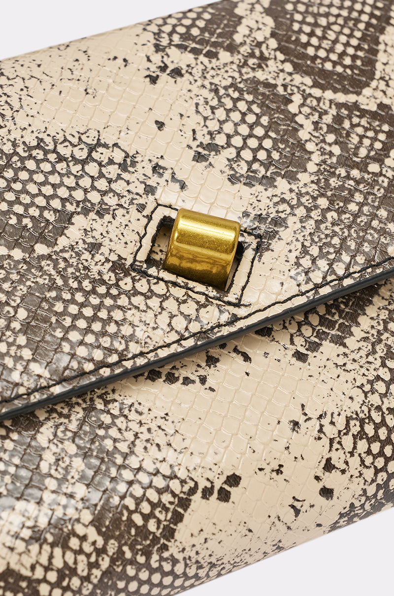 Close-up of the I BITE PURSE, a beige and brown snakeskin print clutch with a gold rectangular clasp; this faux leather accessory adds elegance to any outfit. 4