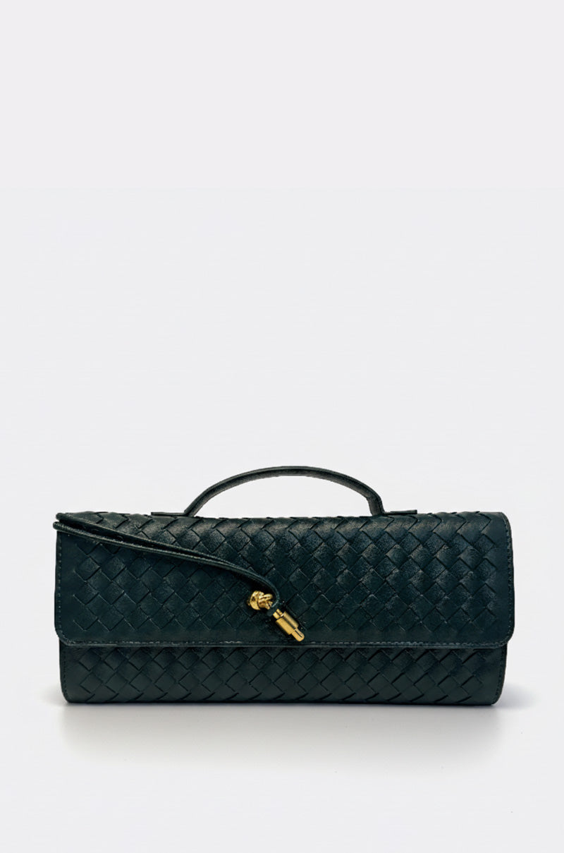 The LUXE LIFE PURSE is a black woven faux leather clutch with a small top handle and a gold twist-lock closure on the front flap, shown on a plain light gray background. 1