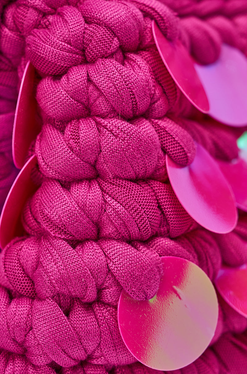 Close-up of the ITS MY WORLD CROCHET SEQUIN CLUTCH, featuring bright pink crochet with large shiny sequins for a bold, textured look—perfect for adding Y2K-inspired flair to your outfit. 4