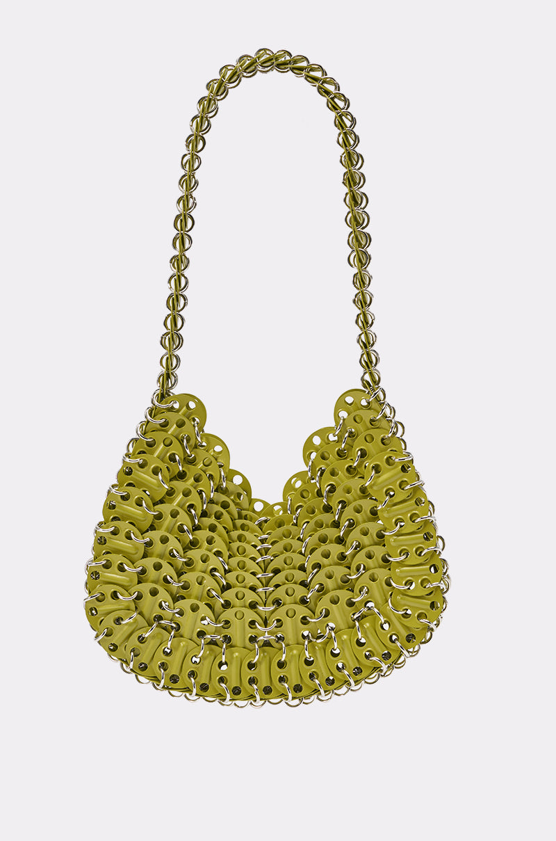 The SUMMER TIME BABY BAG is a chartreuse purse with an intricate woven design, silver grommets, and a matching woven handle, displayed on a plain white background.