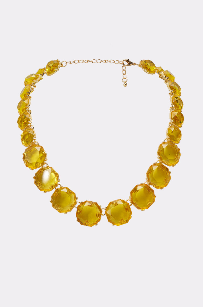 Introducing the CITRINE STATEMENT NECKLACE: a stunning gold necklace featuring large, round citrine gemstones set in individual gold settings, evenly spaced along a delicate gold chain with an adjustable clasp. This sophisticated statement piece is the perfect accessory for evening wear or as an elegant necklace for wedding guests.
