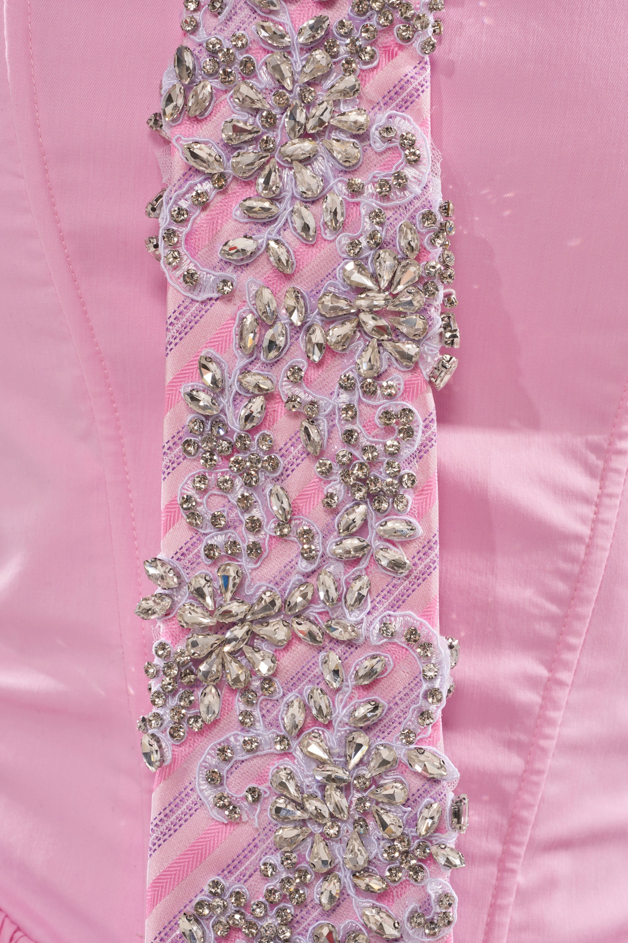 Close-up of the FEMME APPLIQUE TIE, featuring pink satin with rhinestone accents and detailed floral patterns on vertical lace and ribbon strips. 6