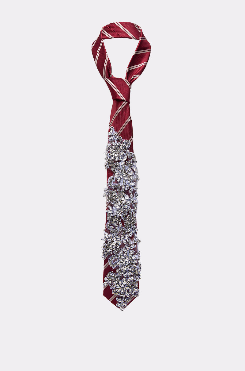 The NOT YOUR TYPICAL TIE IN RED by AKIRA features white diagonal stripes and silver and clear beaded embellishments clustered on the lower half for a bold, eye-catching look. 2