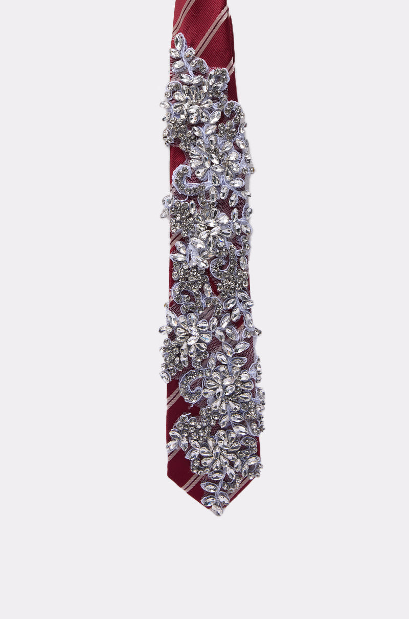The NOT YOUR TYPICAL TIE IN RED features bold red stripes, detailed silver beading, and sparkling rhinestone embellishments in a dazzling floral design. 3