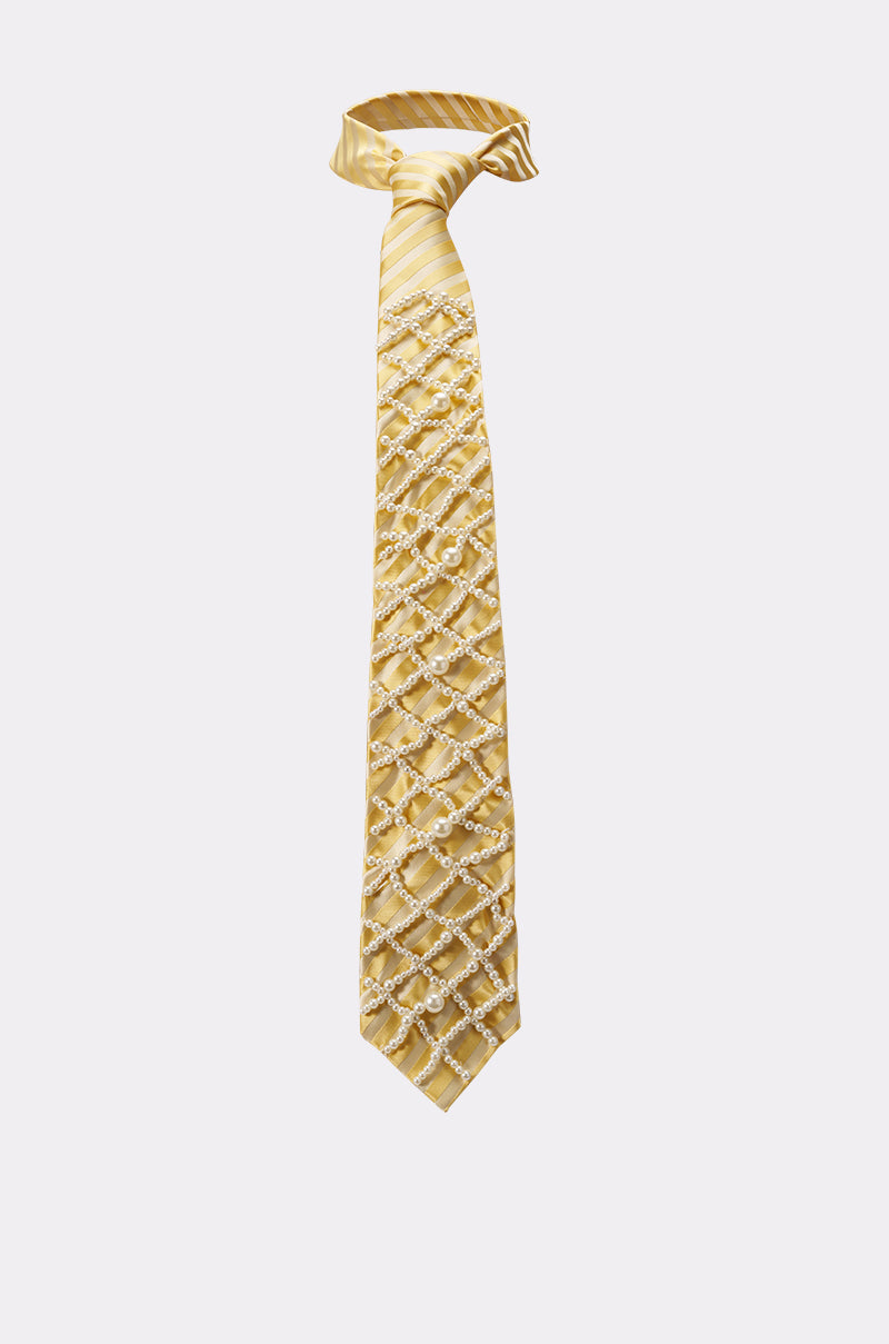 The FEMME APPLIQUE TIE is a butter yellow necktie with diagonal satin stripes and a crisscross pattern of small white circles, shown against a plain light background. 3