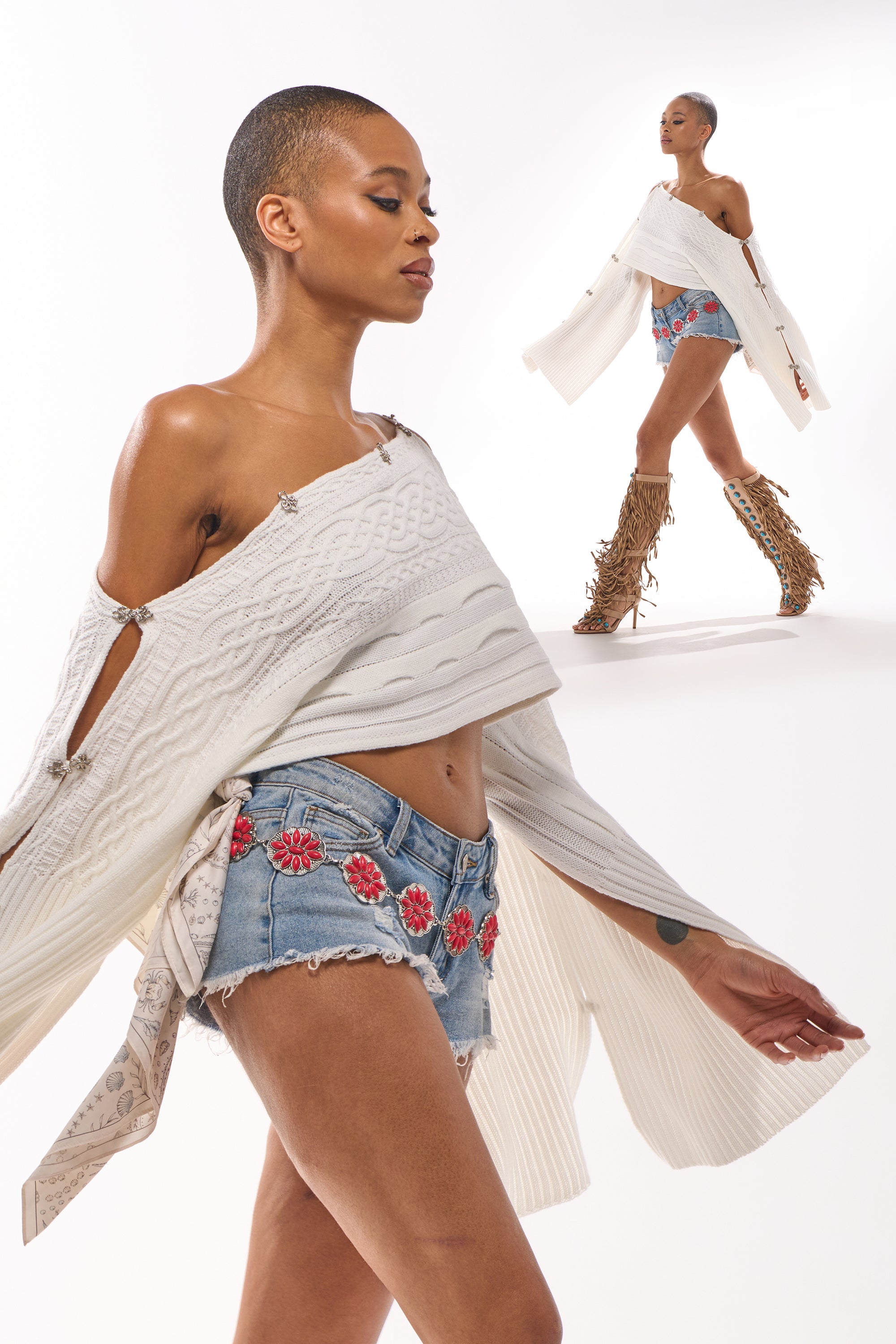 A woman with a shaved head wears a white off-shoulder sweater, denim shorts with red floral embroidery, and the THRU THE STORM BELT. As she walks confidently, she poses in tall fringed boots and the same outfit in the background. 2