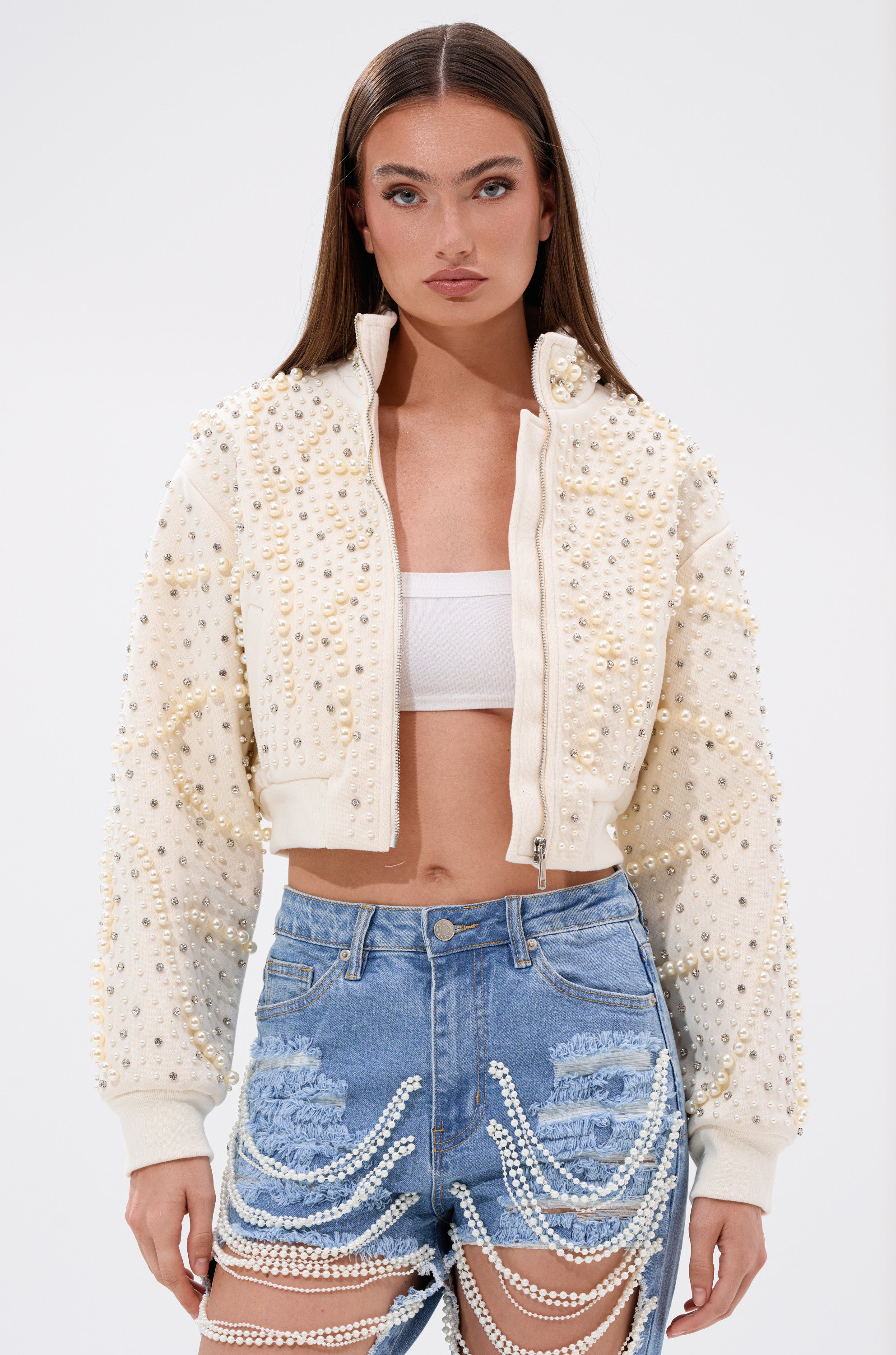 A woman in the GOODIE TWO SHOES EMBELLISHED BOMBER from the AKIRA Label. 4