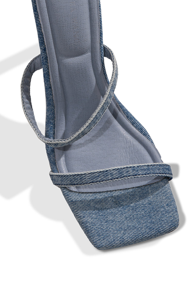 Close-up of the AZALEA WANG KRISTINE DENIM STILETTO GLADIATOR SANDAL featuring an open square toe, blue denim fabric, and two slim denim straps across the front.