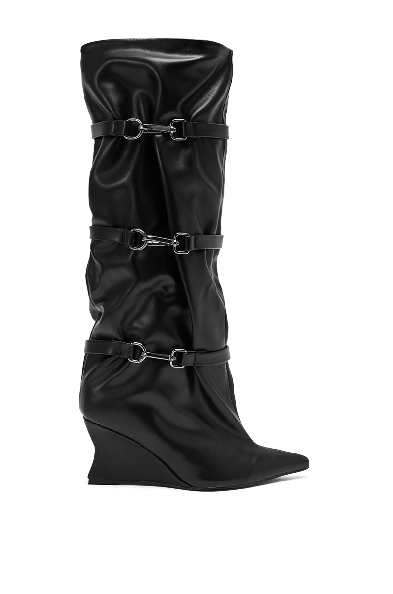 The AZALEA WANG KULLERVO BLACK SILVER CLASP DETAIL WEDGE BOOT features black faux leather, a pointed toe, slouchy knee-high shaft, and three silver clasp straps evenly spaced along the length.