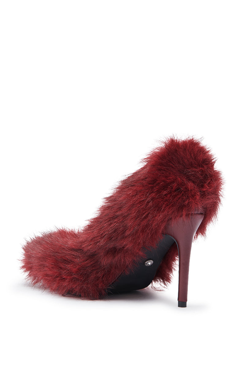 The AZALEA WANG KURT BURGUNDY FUR EMBELLISHED PUMP is a stiletto-heeled shoe covered in dark red faux fur, shown from the back and side against a white background.