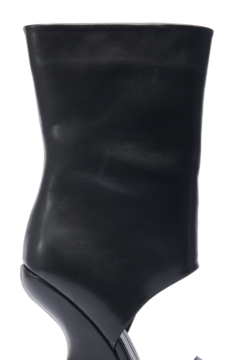 A close-up of the AZALEA WANG KYVEKI Black Wedge Open Toe Bootie, featuring a modern faux leather design with a sculptural curved wedge heel and a high, fitted shaft.